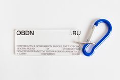 a pair of blue scissors sitting on top of a white label with the word orbitn