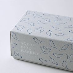 a box that has some kind of bird design on it