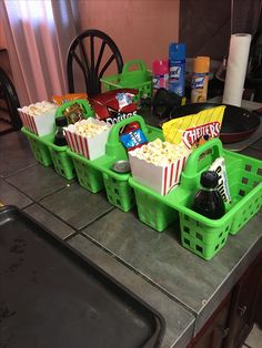 some green baskets filled with food on top of a counter