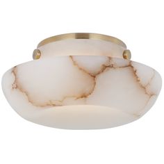 a semi flush light fixture with white marbled glass and brass accents on the bottom