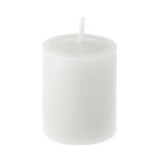 a white candle is lit on a white background