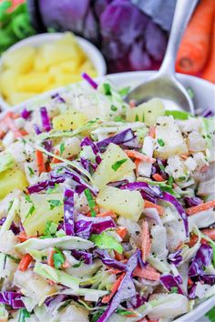 a white bowl filled with coleslaw and carrots