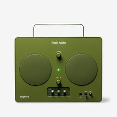 a green radio sitting on top of a table