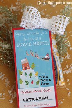 a christmas movie night ticket sitting on top of a table