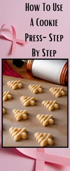 cookies are arranged on a baking sheet with pink ribbon in the middle and title how to use a cookie press - step by step