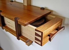 a close up of a wooden shelf with drawers