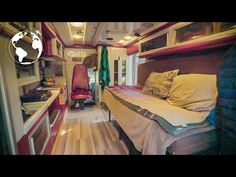 a bed sitting inside of a bedroom on top of a wooden floor next to a window