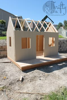 a small house made out of plywood and wood