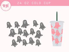 a cup with some pink and grey ghost decorations on it, next to a set of cut outs