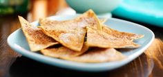 some tortilla chips are on a blue plate