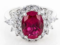 an oval shaped ruby and diamond ring