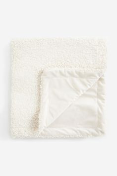 a white blanket on top of a table