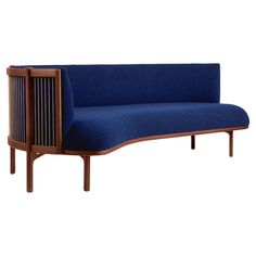 a blue couch sitting on top of a wooden frame