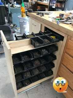 a workbench with lots of drawers and tools