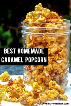 a jar filled with caramel popcorn sitting on top of a table