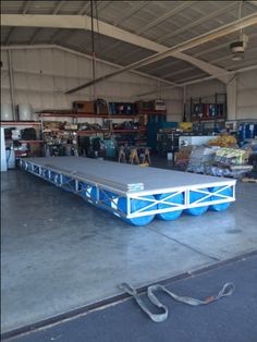 a large blue and white table in a garage