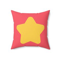 a pink pillow with a yellow star on it