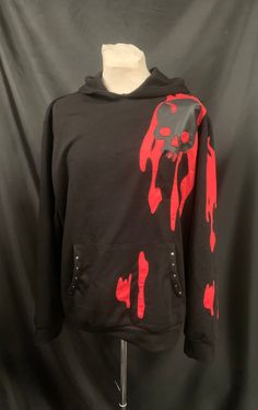 This is a black Raven cotton mix hoody . It has a cut out skull on the front and the back with faux leather . Also has red flame detail on the sleeve . It has pouch pocket with metal studding . This is a one size . Fits upto a 42 chest. Limited edition. Thanks for looking Black Hooded Emo Sweatshirt, Black Emo Hoodie For Streetwear, Edgy Long Sleeve Halloween Hoodie, Black Grunge Hoodie For Alternative Fashion, Punk Halloween Hoodie Sweatshirt, Punk Style Halloween Hoodie For Streetwear, Black Punk Hoodie For Alternative Fashion, Black Punk Hoodie For Concert, Black Halloween Sweatshirt For Alternative Fashion