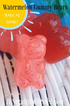 two gummy bears sitting next to each other on top of a wicker table