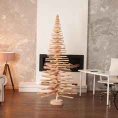 a wooden christmas tree in a living room