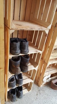 several pairs of shoes are stacked on shelves