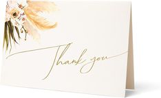 a thank you card with watercolor flowers and leaves on the front in gold foil