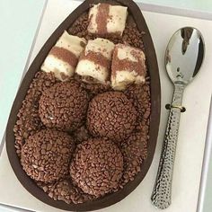 a chocolate dessert with marshmallows in it and a spoon next to it