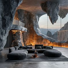 a living room filled with lots of furniture and walls covered in cave like rock formations