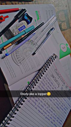 notebooks and pens are sitting on top of an open spiral - bound book with the title study like a topper