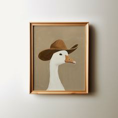 a white duck wearing a brown cowboy hat