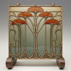 an art deco style glass panel with flowers on the front and side panels, set against a white background