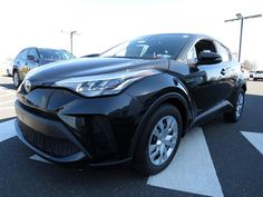 a black toyota suv parked in a parking lot