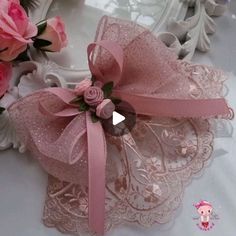 the pink ribbon is attached to the lace