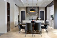 a dining room table and chairs in a kitchen