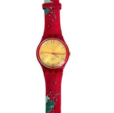 The Swatch Gent HOLLY JOY was the Christmas Special 2004, limited to 14,999 worldwide. The HOLLY JOY was inspired by an old custom. The deep red leather strap is characterized by the detailed embroidery, consisting of the green branches and berries of the holly tree. The golden dial also features the motif and the colors of the strap. The water-resistant watch has an accurate quartz movement.  This Swatch GZ189 comes in perfect unworn condition and comes with a new battery installed. Case and pa Holly Tree, Water Resistant Watch, Detailed Embroidery, Swatch Watch, Christmas Special, Wrist Watches, Leather Band, Deep Red, Quartz Movement