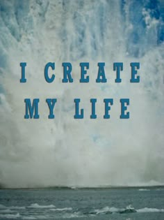 the words i create my life written in blue ink on an ocean background with waves