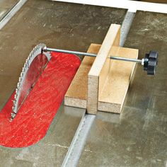 an image of a red rug being worked on with a circular sawtoothing tool