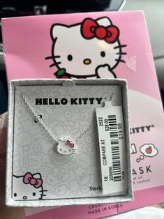 the hello kitty necklace is in its box and it's ready to be bought