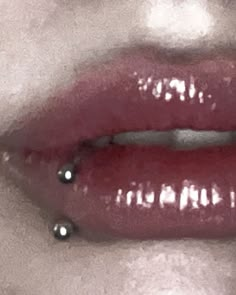 a woman's lips with silver and red lipstick