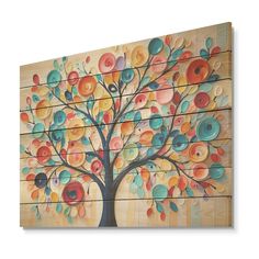 an abstract painting on wood depicting a tree with multicolored circles painted on it