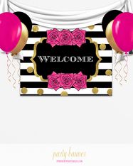 a welcome sign with pink roses and gold foil balloons on black and white striped background