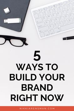 a computer keyboard, glasses and pen on top of a desk with the words 5 ways to build your brand right now