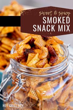 sweet and spicy smoked snack mix in a glass jar with the title text overlay