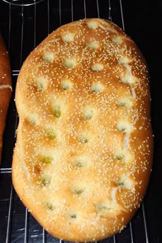 two buns sitting on top of a rack next to each other