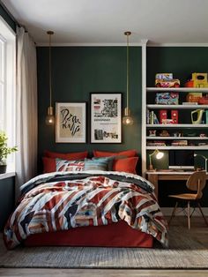 a bedroom with green walls and red bedspread, bookshelf in the background