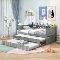 a child's bedroom with blue walls and wooden floors