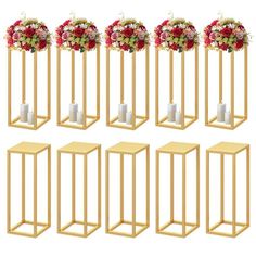 a set of six gold metal stands with flowers and candles on each side, all in different sizes