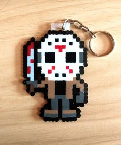 a keychain made to look like an old school video game character