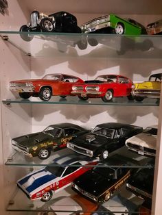 a display case filled with lots of toy cars