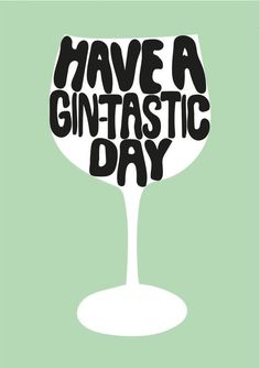 a wine glass with the words have a gintasstic day written in black on it